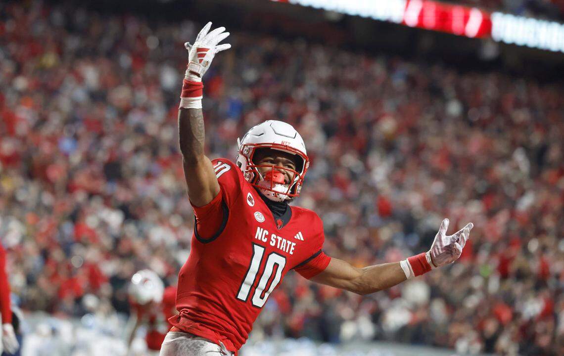 N.C. State wide receiver KC Concepcion (10) celebrates after scoring on a 11-yard touchdown reception during the first half of N.C. State’s game against UNC at Carter-Finley Stadium in Raleigh, N.C., Saturday, Nov. 25, 2023.