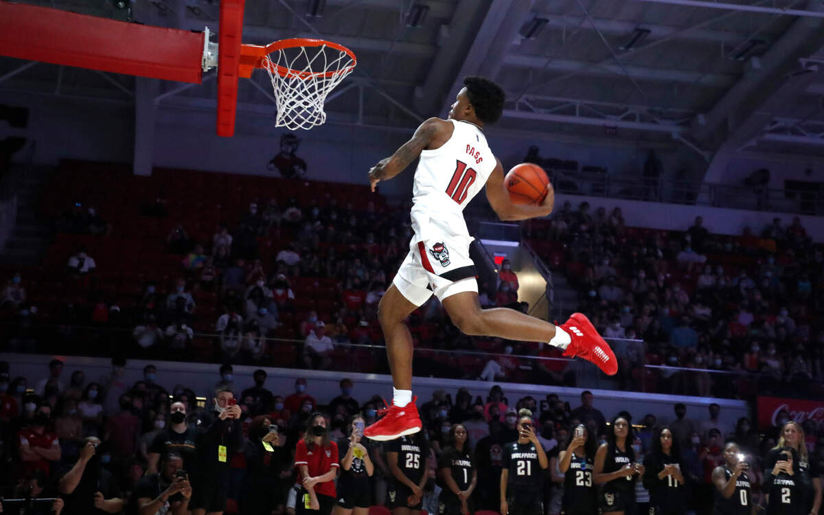 N.C. State’s Breon Pass (10) slams in two during the slam dunk competition during the Primetime with the Pack event at Reynolds Coliseum in Raleigh, N.C., Thursday, October 14, 2021.
