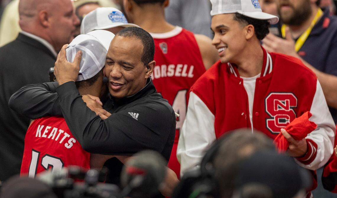 N.C. State coach Kevin Keatts embraces his son K.J. Keatts (13) as they celebrate the Wolfpack’s ACC Tournament Championship following their 84-76 victory over North Carolina at Capitol One Arena on Saturday, March 16, 2024 in Washington, D.C.