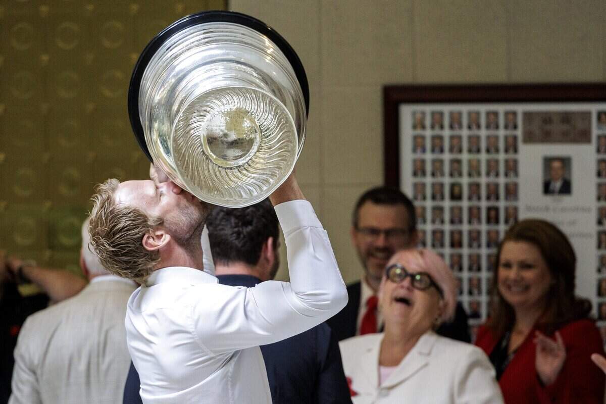 Carolina Hurricanes’ Jordan Staal kissed the Stanley Cup as he accompanied his teammate Jordan Martinook and head coach Rod Brind'Amour to the North Carolina State Legislature during a visit on Tuesday, June 23, 2026, in Raleigh.