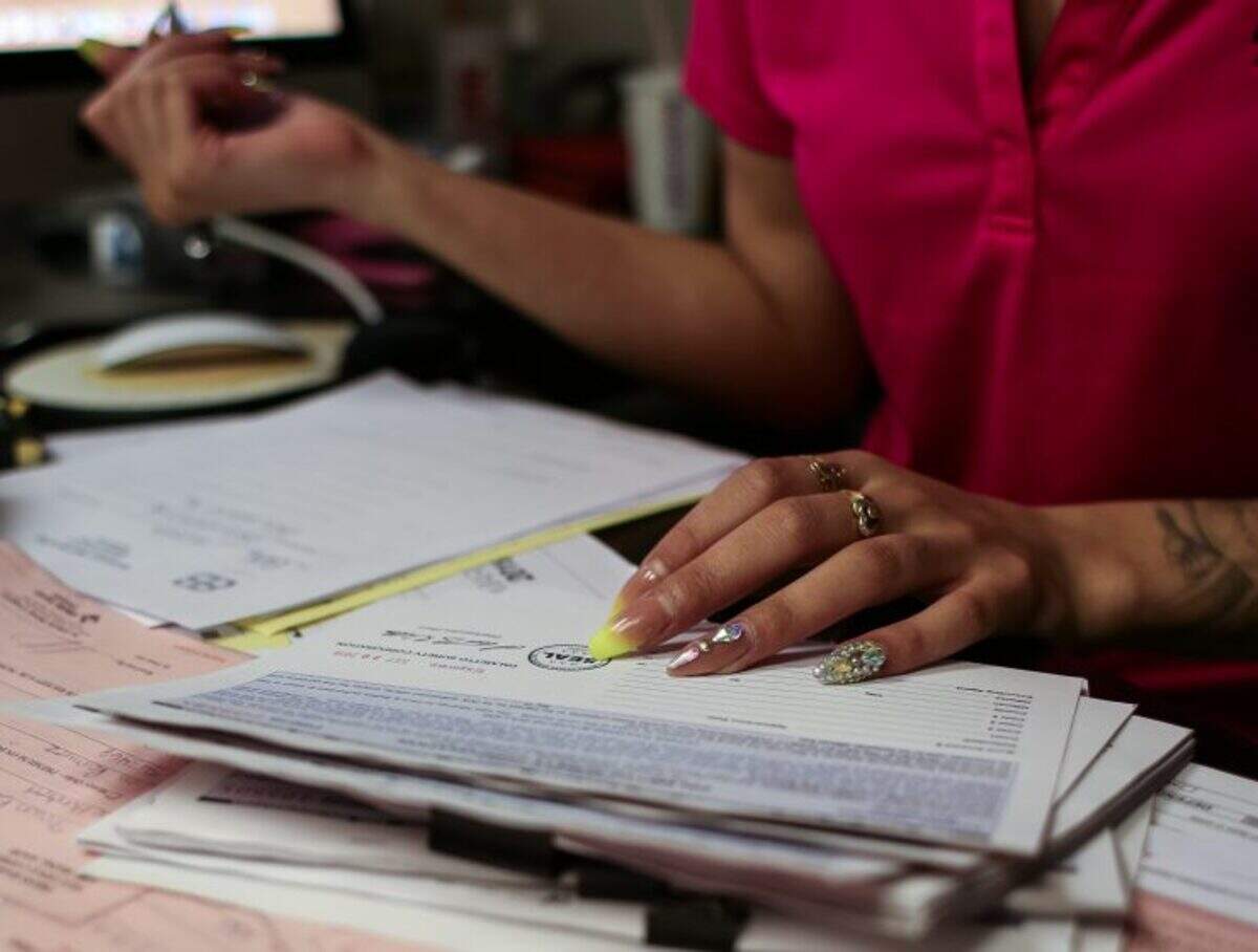 Kiara Brewster of Brewster’s Bail Bonding in Wilmington. Mondays are busy days. New arrests over the weekend mean a stream of new clients and paperwork for Brewster and her team of bail agents to file and process in court.