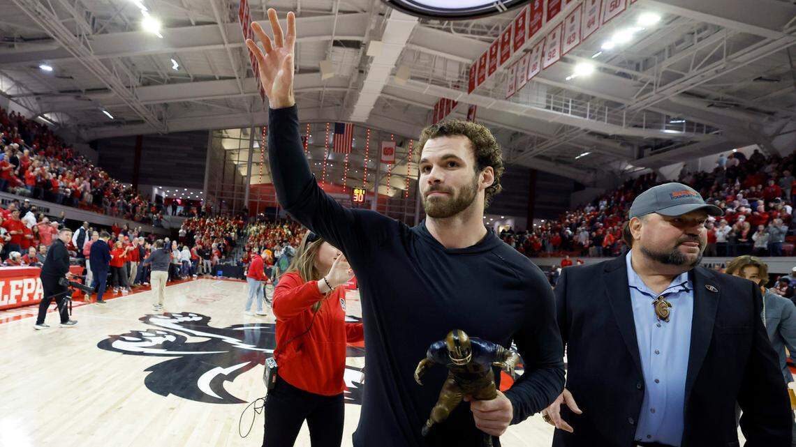 N.C. State linebacker Payton Wilson walks off the court after being awarded The Butkus Award during a timeout during N.C. State’s game against Maryland Eastern Shore at Reynolds Coliseum in Raleigh, N.C., Wednesday, Dec. 6, 2023.