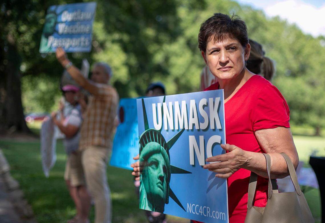 Jaima Teasley calls for the elimination of the mask mandate for school children, with a group of demonstrators at the NC Department of Health and Human Services at Dix Park on Wednesday, June 23, 2021 in Raleigh, N.C.