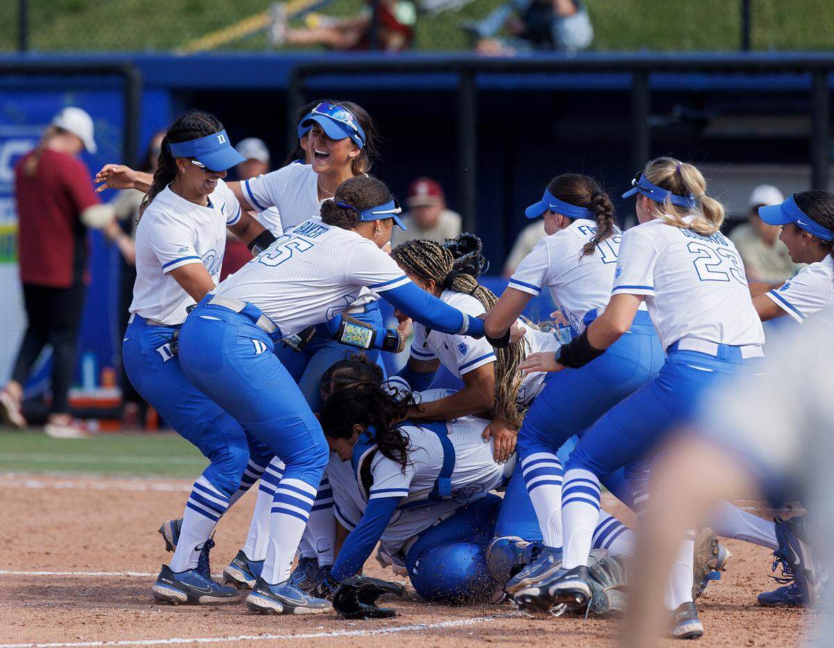Duke players celebrate following the Blue Devils’ 6-3 win over Florida State in the ACC Tournament final on Saturday, May 11, 2024, in Durham, N.C.