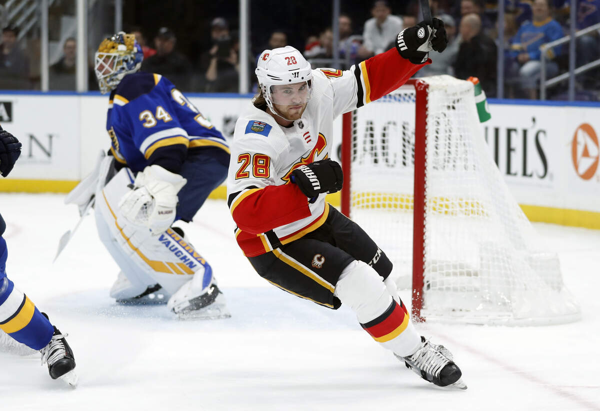 Calgary Flames’ Elias Lindholm (28), of Sweden, celebrates after scoring past St. Louis Blues goaltender Jake Allen (34) during the first period of an NHL hockey game Sunday, Dec. 16, 2018, in St. Louis. (AP Photo/Jeff Roberson)