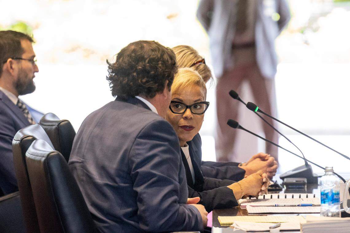 Gov. Roy Cooper’s Chief of Staff Kristi Jones, right, and General Counsel Eric Fletcher, center, testify before the House Oversight and Reform Committee to respond to accusations of meddling in the SBI by its Director Bob Schurmeier Tuesday, May 2, 2023 at the State Legislative Building.