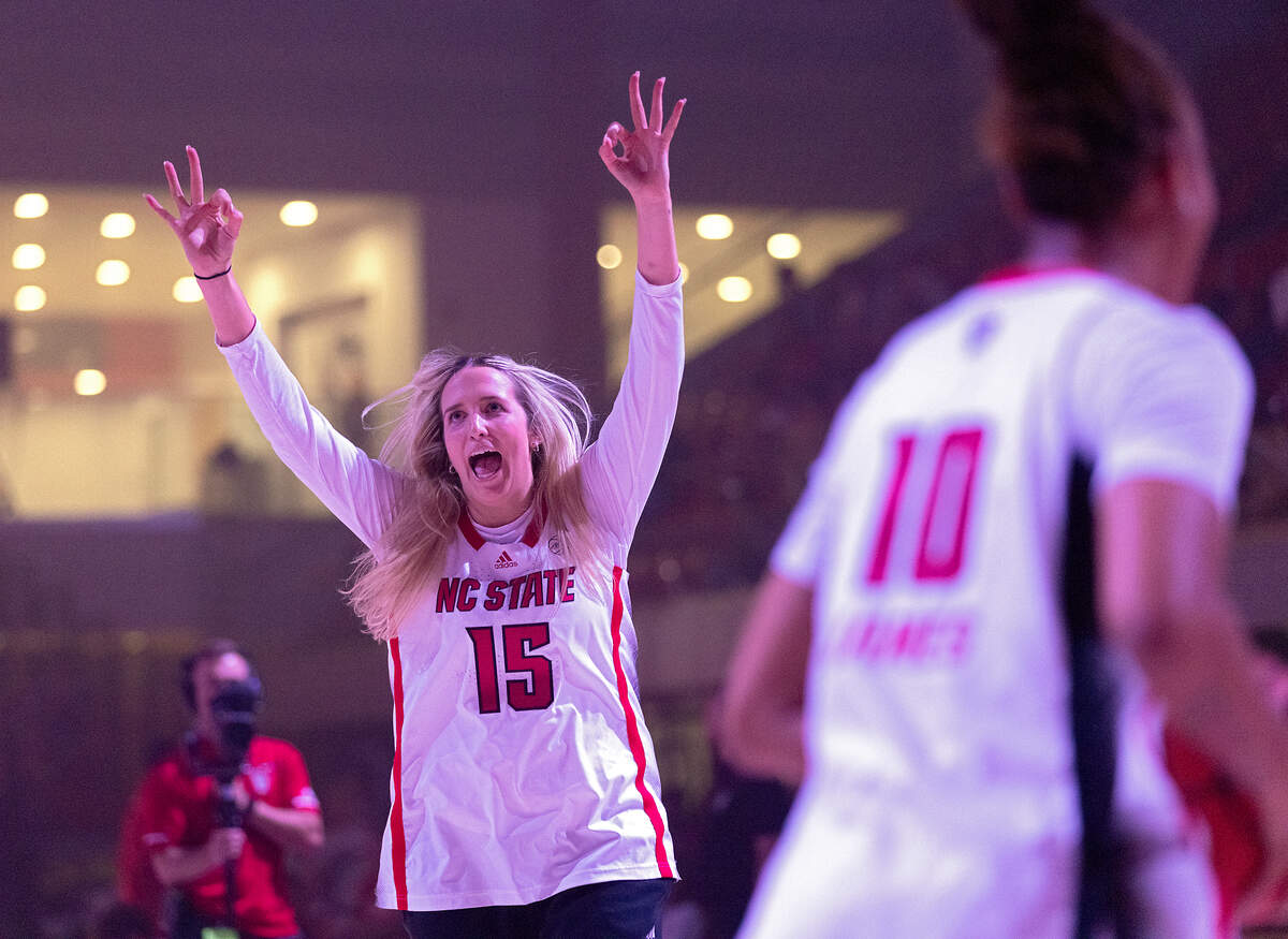 N.C. State’s Lizzy Williamson reacts after making a three-point basket during the “Primetime with the Pack” preseason event on Thursday, Oct. 26, 2023, at Reynolds Coliseum in Raleigh, N.C.