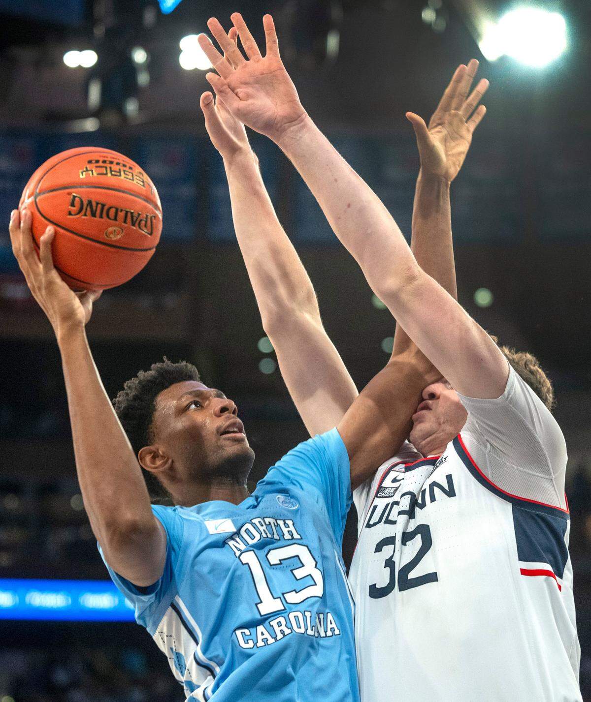 North Carolina’s Jalen Washington (13) puts up a shot against Connecticut’s Donovan Clingan (32) during the second half in the Jimmy V Classic on Tuesday, December 5, 2023 at Madison Square Garden in New York, NY.