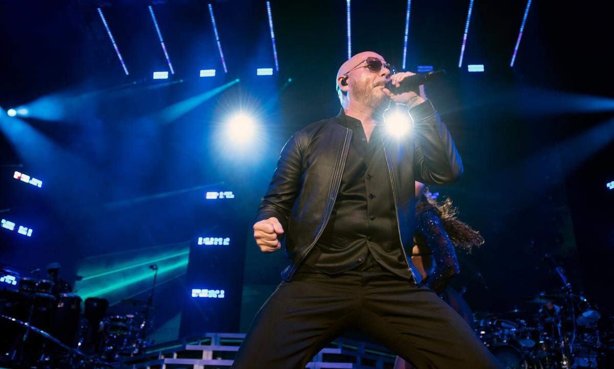 Pitbull takes the stage as he opens his “Can’t Stop Us Now Tour” at Coastal Credit Union Music Pavilion at Walnut Creek in Raleigh, N.C., Thursday night, July 28, 2022.