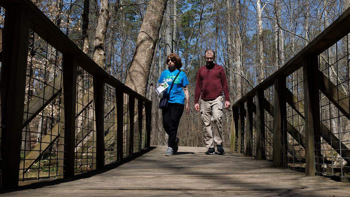 Carol Offen and her son, Paul Offen, walk on a trail in the North Carolina Botanical Garden on Wednesday, March 13, 2024, in Chapel Hill, N.C. Carol, who gave Paul a kidney 17 years ago, now advocates for legislation that would offer better protections for live donors.