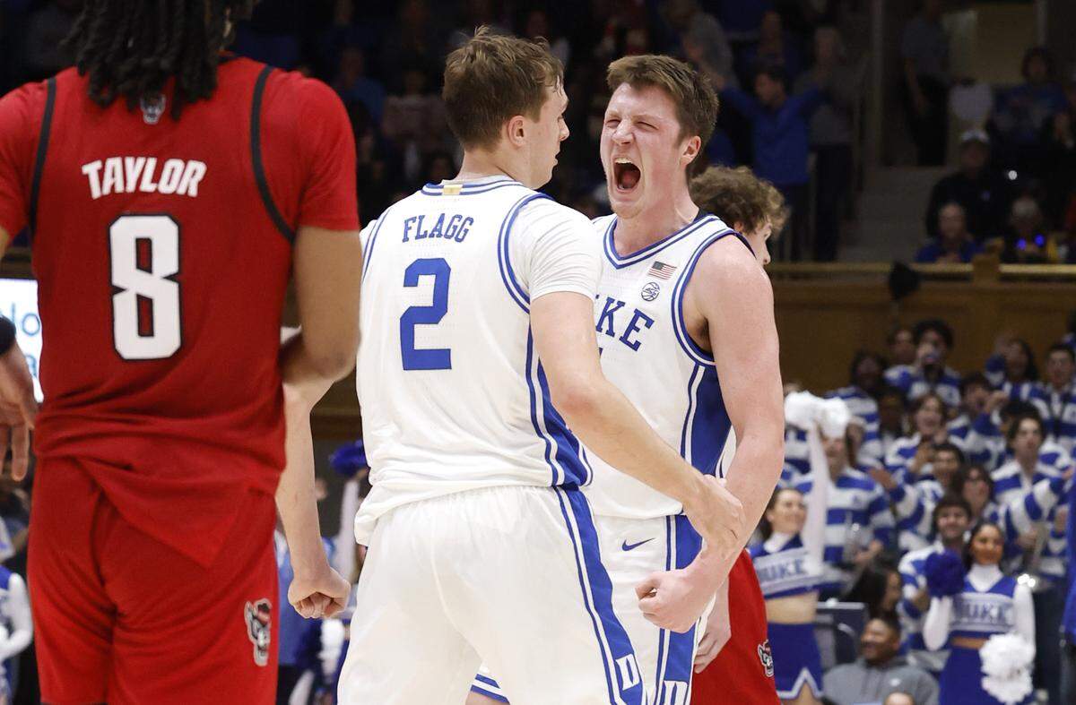 Duke’s Kon Knueppel (7) celebrates with Cooper Flagg (2) after Flagg slammed in two during the second half of Duke’s 74-64 victory over N.C. State at Cameron Indoor Stadium in Durham, N.C., Monday, Jan. 27, 2025.