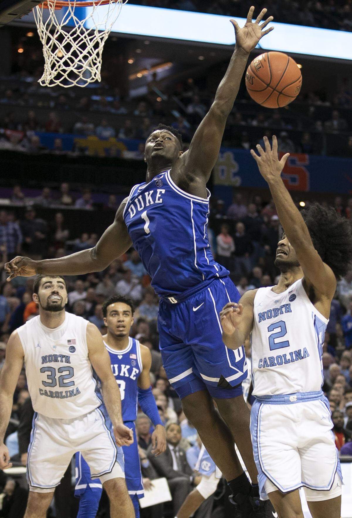 Duke’s Zion Williamson (1) and North Carolina’s Coby White (2) are both star freshmen who have helped their respective teams advance to the NCAA tournament’s Sweet 16. If both teams win three more times, they will meet in the national final.