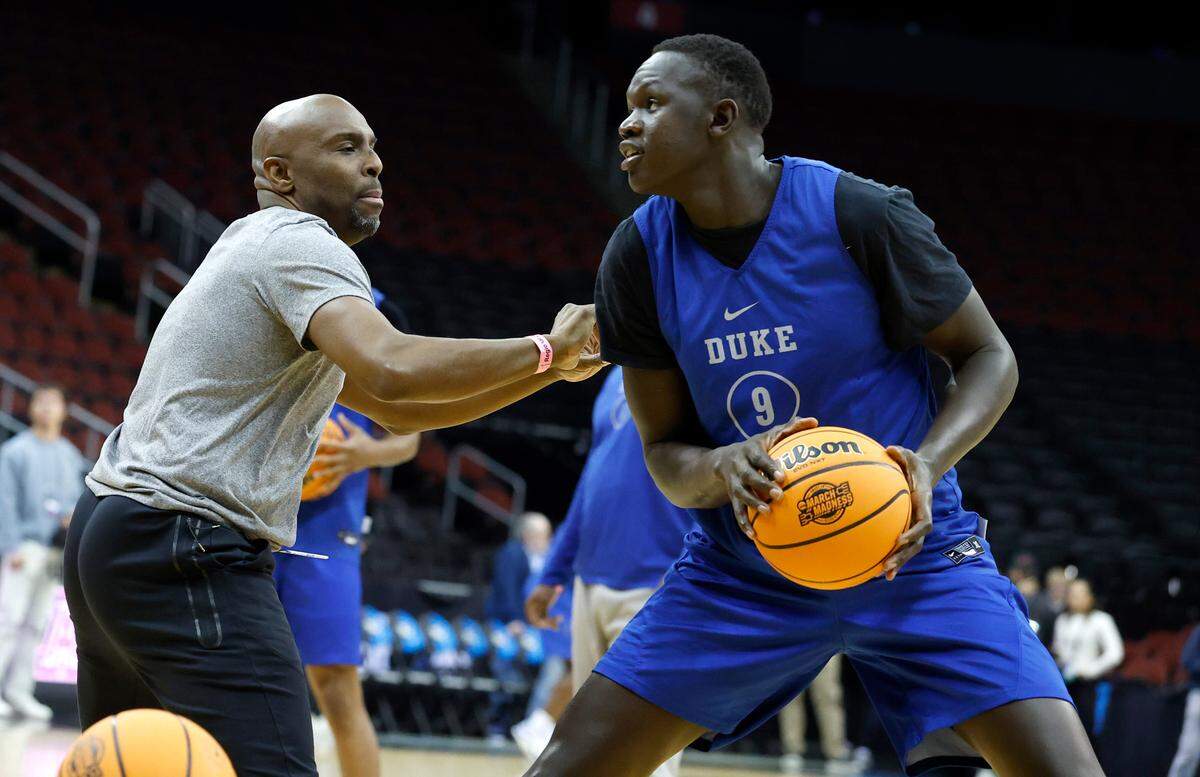 Duke assistant coach Emanuel Dildy works with Khaman Maluach (9) during Duke’s practice at the Prudential Center in Newark, N.J., Wednesday, March 26, 2025. The Blue Devils will face Arizona in their Sweet 16 game Thursday.