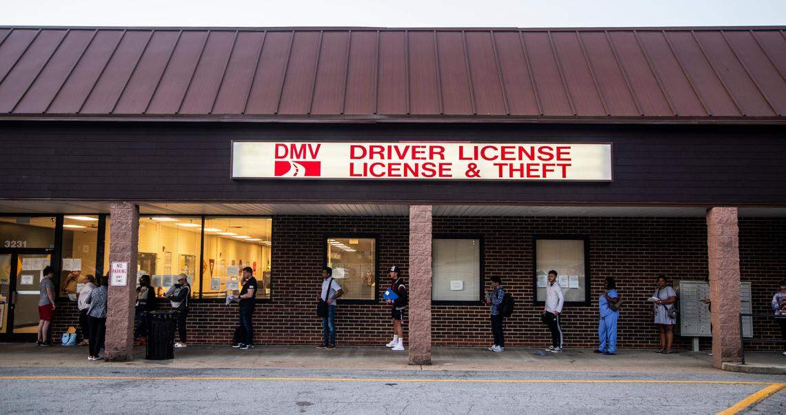 A line forms outside the Department of NC Motor Vehicles’ West Raleigh Driver License Office Friday morning, Sept. 2, 2022.