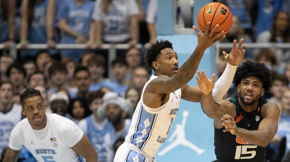 North Carolina’s Leaky Black (1) battles for a defensive rebound with Miami’s Norchad Omier (15) in the first half on Monday, February 13, 2023 at the Smith Center in Chapel Hill, N.C.