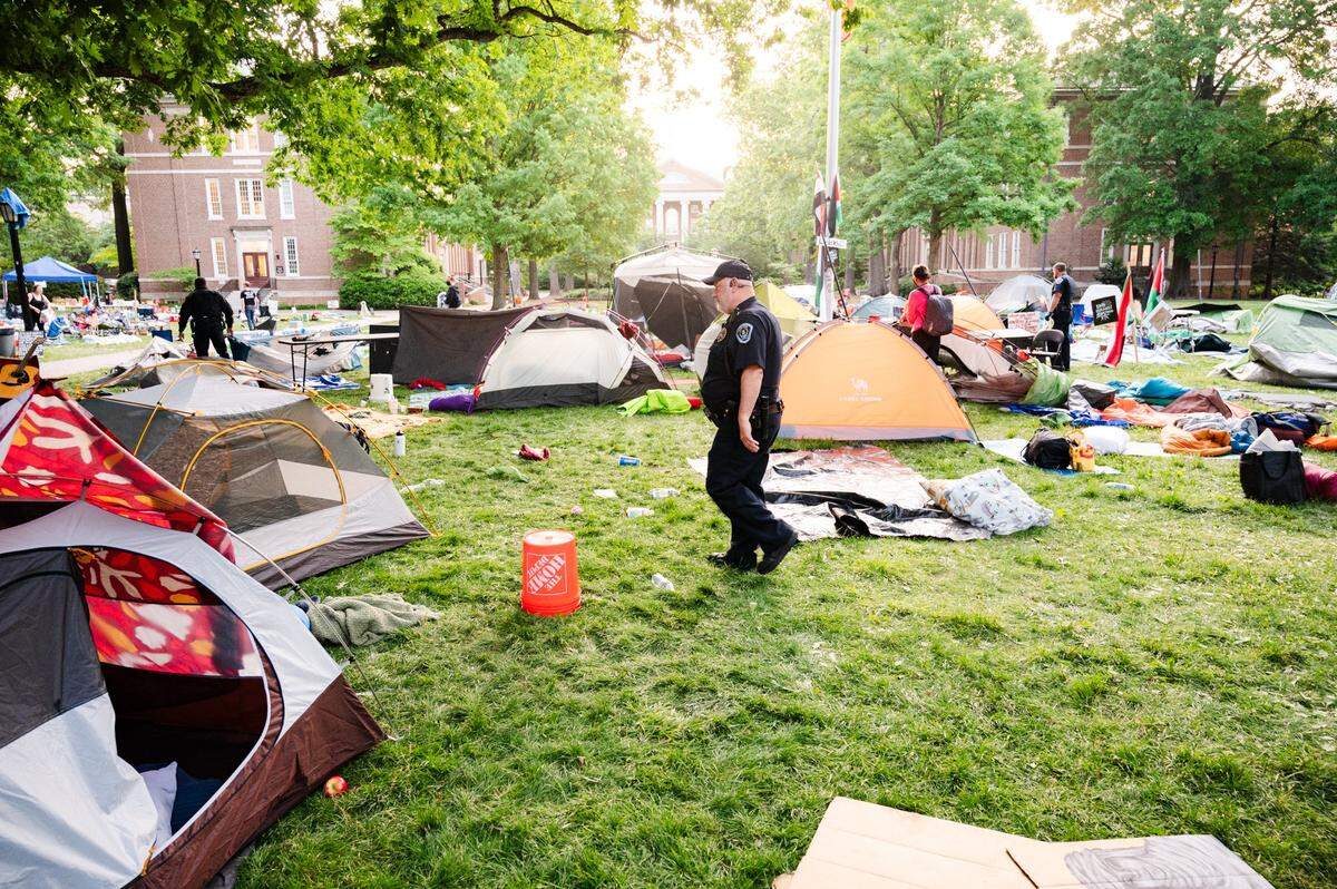 Police officers patrol Polk Place as the “pro-Palestine encampment” is cleared out on Tuesday, April 30, 2024. Earlier in the morning arrests were made.