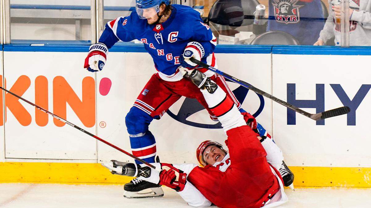 Carolina Hurricanes’ Andrei Svechnikov, below, reacts after colliding with New York Rangers’ Jacob Trouba (8) during the third period of an NHL hockey game Tuesday, Jan. 3, 2023, in New York. The Rangers won 5-3.(AP Photo/Frank Franklin II)
