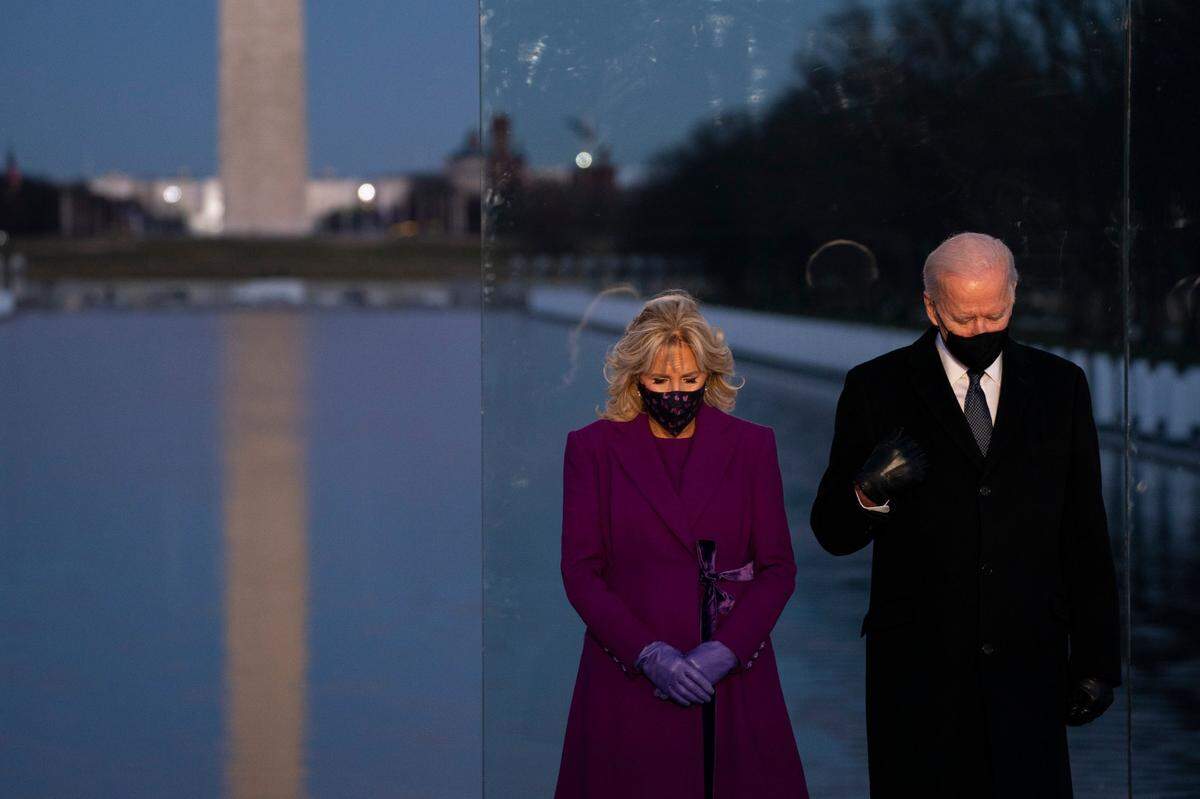 President-elect Joe Biden and his wife Jill Biden participate in a COVID-19 memorial event at the Lincoln Memorial Reflecting Pool, Tuesday, Jan. 19, 2021, in Washington.