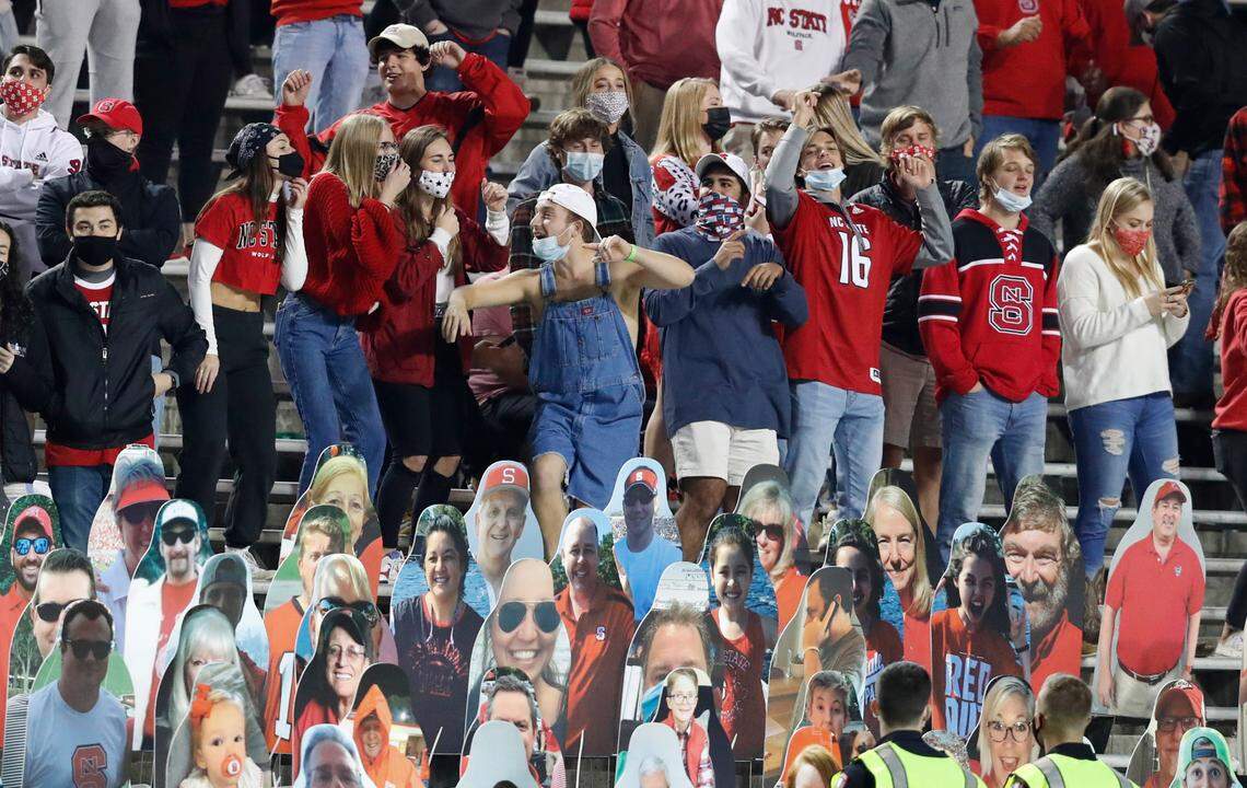 Wolfpack fans cheer on the team during the second half of N.C. State’s 38-22 victory over Florida State at Carter-Finley Stadium in Raleigh, N.C., Saturday, Nov. 14, 2020.