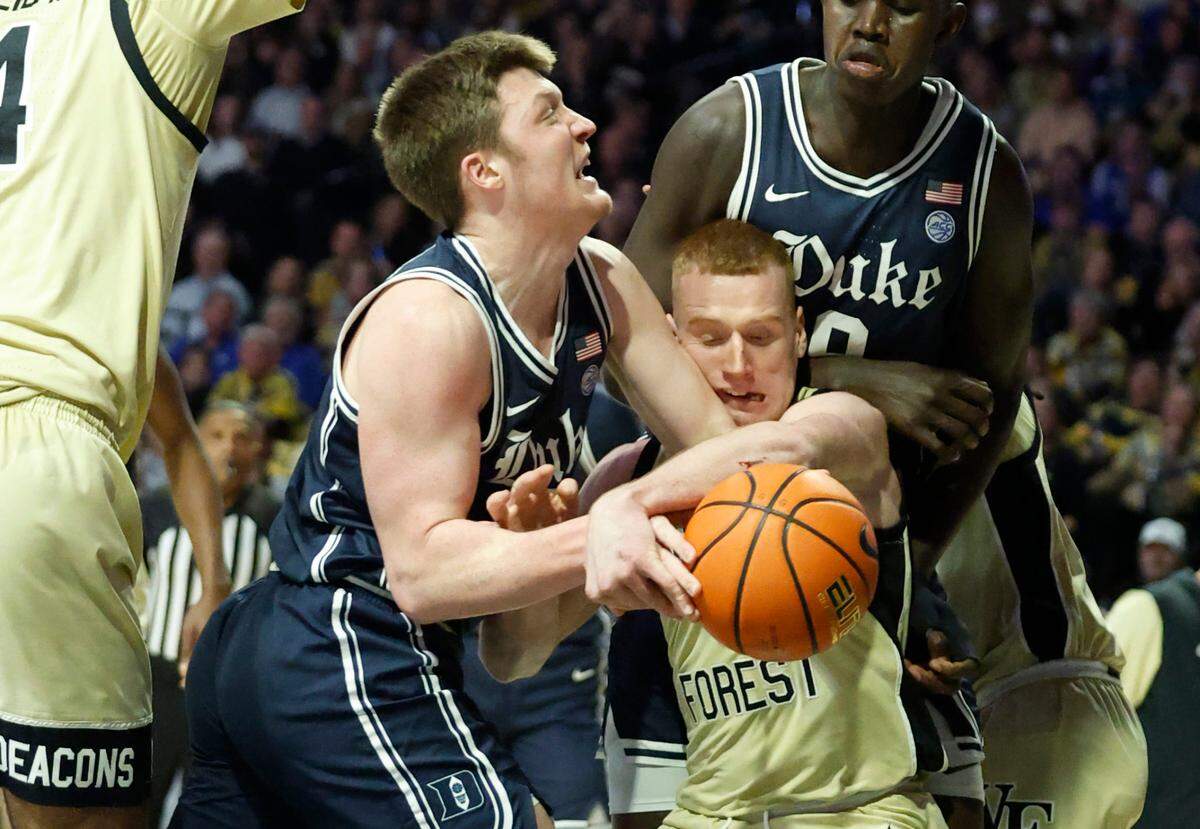 Wake Forest’s Cameron Hildreth (6) defends Duke’s Kon Knueppel (7) during the first half of Duke’s game against Wake Forest at LJVM Coliseum in Winston-Salem, N.C., Saturday, Jan. 25, 2025.