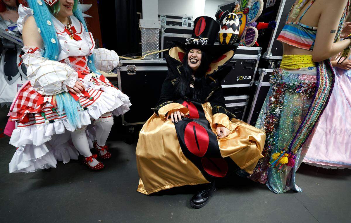 Ashley Hinkle from Burlington waits for the costume competition at GalaxyCon Raleigh, N.C., Saturday, July 27, 2024. Hinkle is dressed as Sir Pentious from Hazbin Hotel.