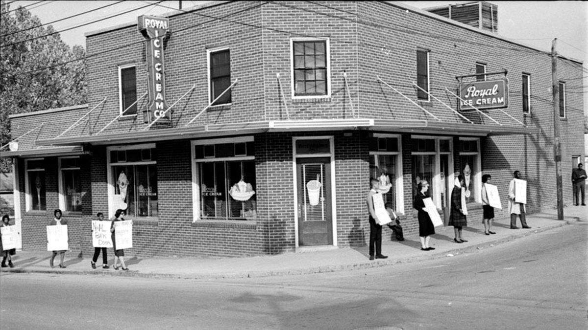 Protesters march outside of the Royal Ice Cream Company in Durham, N.C. in 1957.