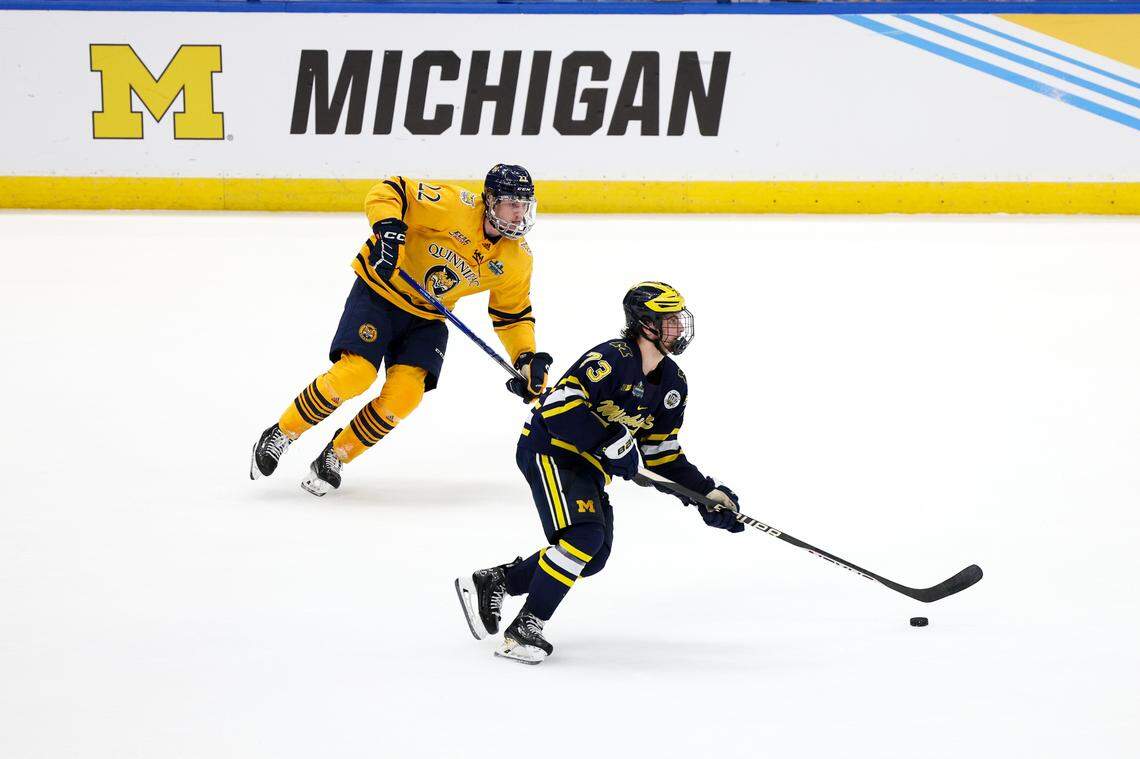 Michigan defenseman Ethan Edwards (73) controls the puck from Quinnipiac forward Skyler Brind’Amour (22) during the second period in the semifinals of the 2023 Frozen Four college ice hockey tournament at Amalie Arena. Quinnipiac won the game. In the final, Brind’Amour was a key player on the tying goal against Minnesota as the Bobcats won their first national title.