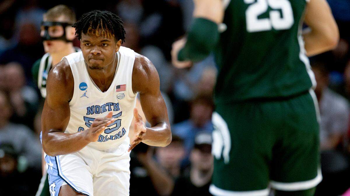 North Carolina’s Harrison Ingram (55) reacts after cutting the Michigan State lead to one point during the first half on Saturday, March 23, 2024, during the second round of the NCAA Tournament at Spectrum Center in Charlotte, N.C.