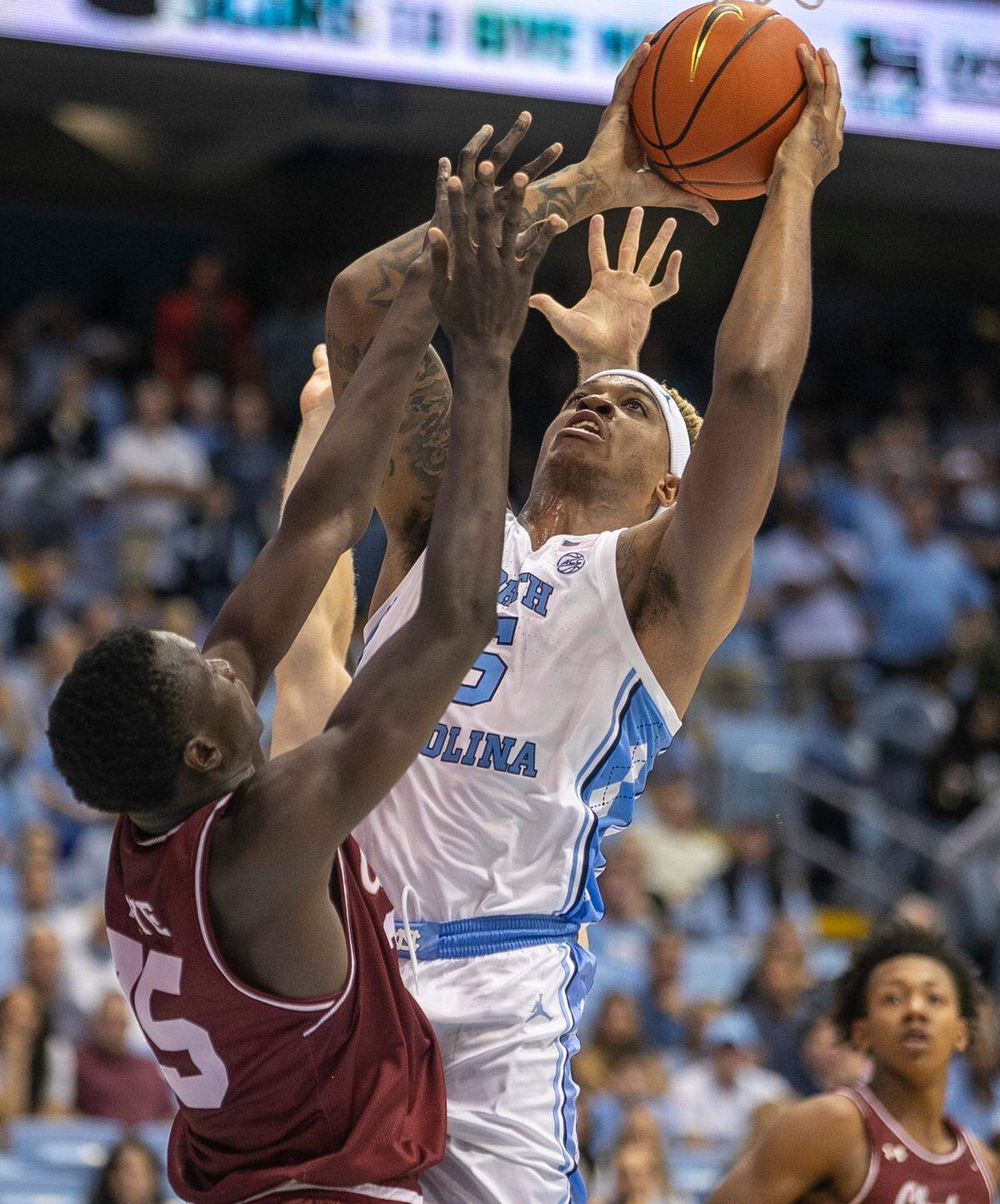 North Carolina’s Armando Bacot (5) muscles his way to the basket against College of Charleston’s Babacar Faye (35) during the second half on Friday, November 11, 2022 at the Smith Center in Chapel Hill, N.C.