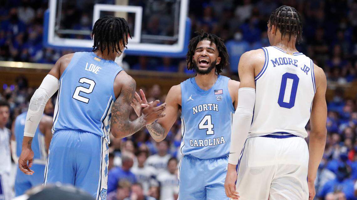 North Carolina’s Caleb Love (2) and R.J. Davis (4) celebrate during the second half of UNC 94-81 victory over Duke at Cameron Indoor Stadium in Durham, N.C., Saturday, March 5, 2022. Dukeís Wendell Moore Jr. (0) is to the right.