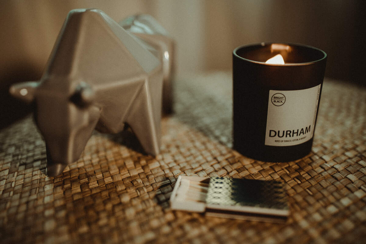 Black Bright’s Durham candle combines the scents of tobacco, cotton, and whiskey.