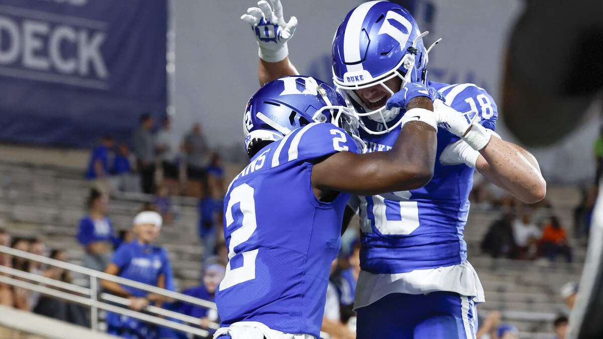 Duke’s Sahmir Hagans and Cooper Barkate celebrate following a touchdown during the second half of the Blue Devils’ 45-17 win over Elon on Thursday, Aug. 28, 2025, at Wallace Wade Stadium in Durham, N.C.