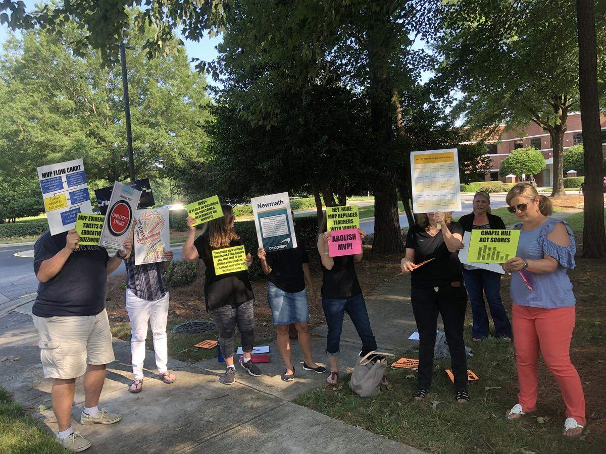 Parents protest the use of the MVP math curriculum outside the Wake County school system’s headquarters in Cary, N.C., on June 4, 2019.