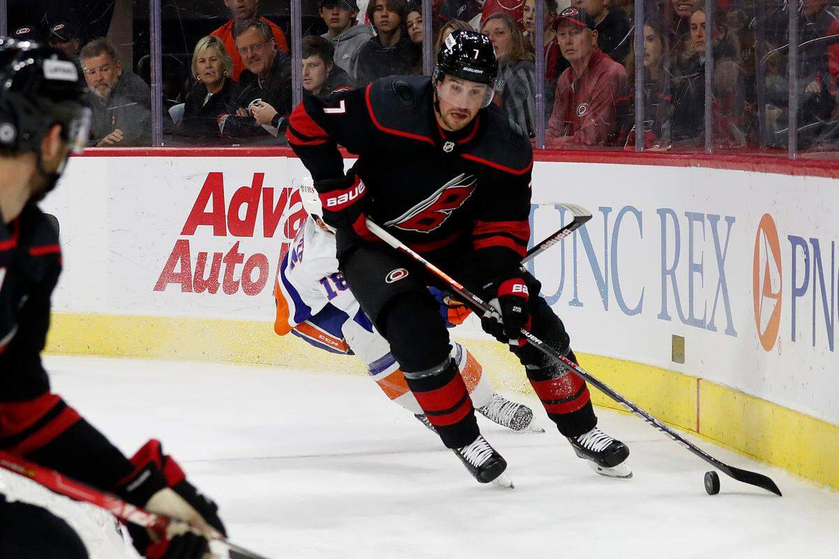 Carolina Hurricanes’ Brendan Smith (7) moves the puck New York Islanders during the first period of an NHL hockey game in Raleigh, N.C., Friday, April 8, 2022. (AP Photo/Karl B DeBlaker)