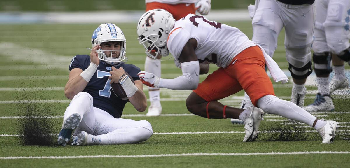 Virginia Tech’s Chamarri Conner (22) is called for targeting after hitting North Carolina quarterback Sam Howell (7) in the first quarter on Saturday, October 10, 2020 at Kenan Stadium in Chapel Hill, N.C.Conner was ejected from the game.