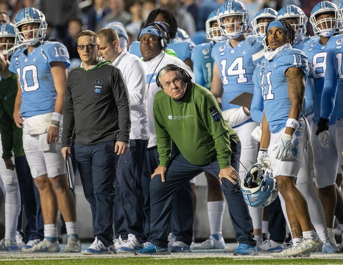 North Carolina coach Mack Brown watches with Josh Downs (11) as Noah Brunette kicks a 31-yard field goal in the second quarter to give the Tar Heels’ a 10-0 lead on Saturday, November 19, 2022 at Kenan Stadium in Chapel Hill, N.C.