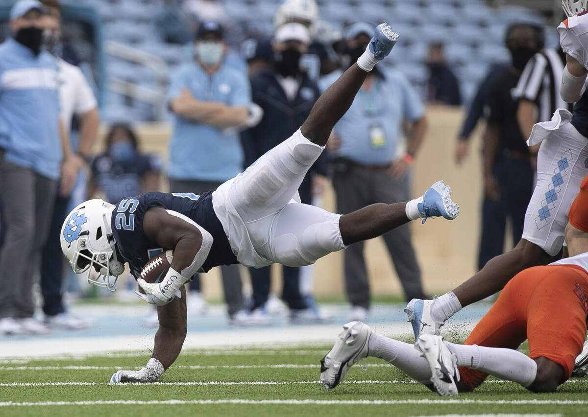 North Carolina’s Javonte Williams (25) picks up 14-yards on a run in the third quarter against Virginia Tech on Saturday, October 10, 2020 at Kenan Stadium in Chapel Hill, N.C.