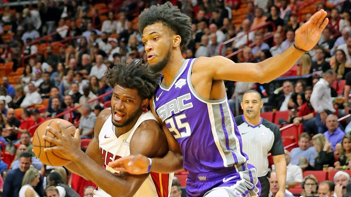 Miami Heat’s Justise Winslow drives against another former Duke player, Marvin Bagley III, now with the Sacramento Kings, at the AmericanAirlines Arena in Miami, Florida, Monday, October, 29, 2018.
