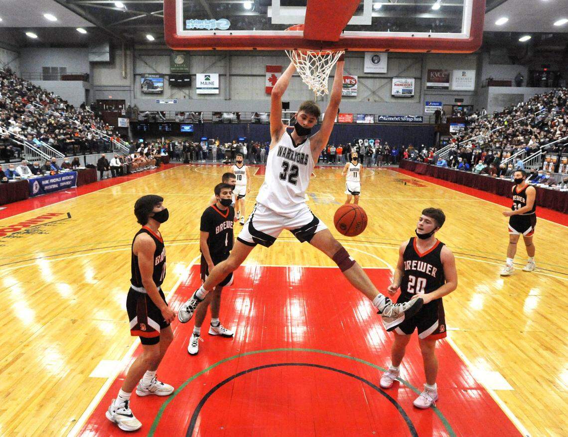 Nokomis High School’s Cooper Flagg (32) scores with authority against Brewer High School’s in the boys Class A North finals game at the Augusta Civic Center on Saturday, February 26, 2022. (Morning Sentinel photo)