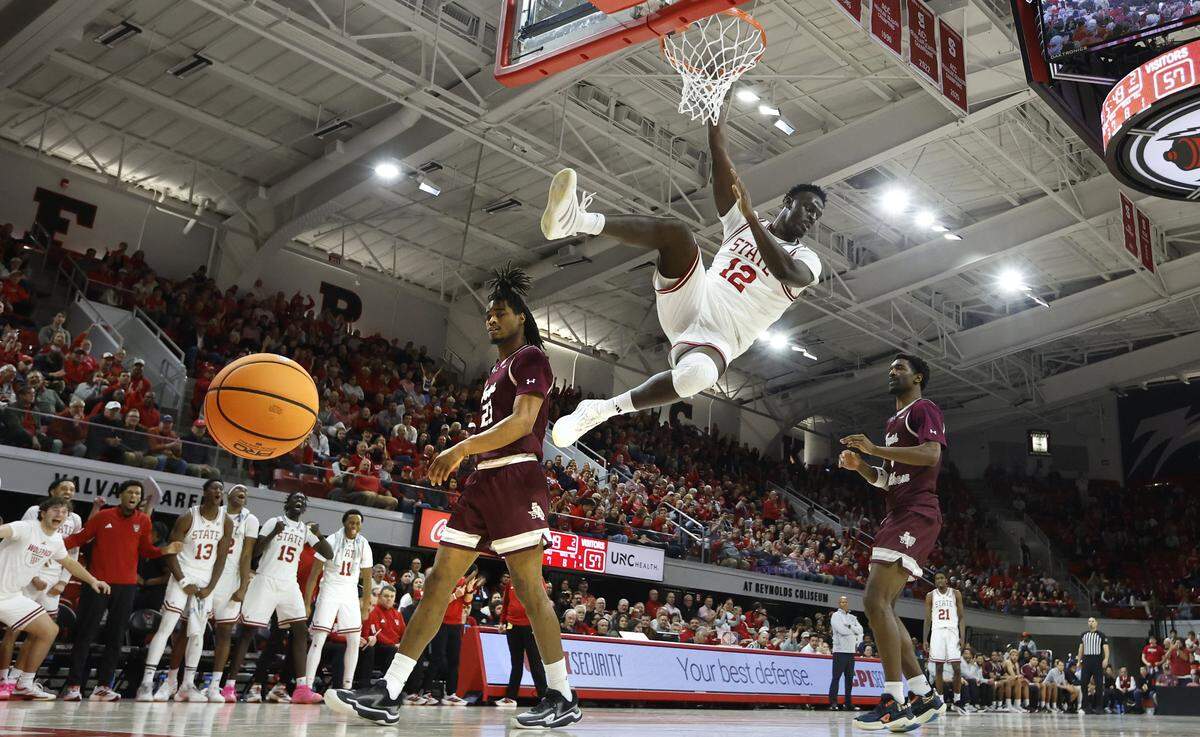 N.C. State's Scottie Ebube (12) slams in two during N.C. State’s 108-72 victory over Texas Southern at Reynolds Coliseum in Raleigh, N.C., Wednesday, Dec. 17, 2025.