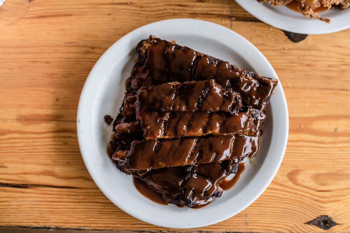 Wyatt Dickson owns Picnic in Durham with Ryan Butler. Dickson also has plans to open Wyatt’s in Raleigh. Juicy and tender ribs come pre-sauced.