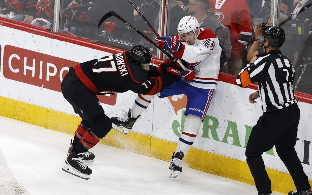 Carolina's Mark Jankowski (77) checks Montréal's Lane Hutson (48) during the second period of the Hurricanes’ game against the Canadiens in game one of the Eastern Conference Finals at the Lenovo Center Thursday, May, 21, 2026.
