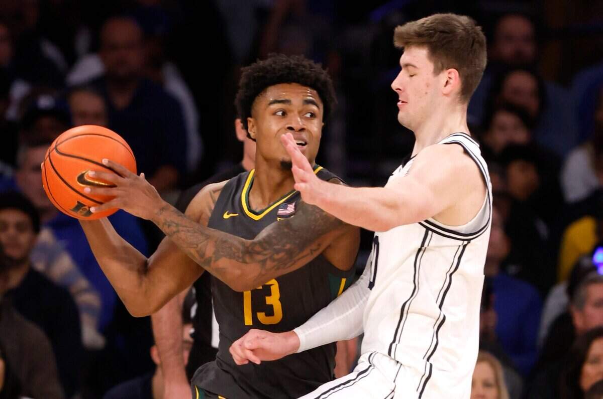 Duke’s Kyle Filipowski (30) defends Baylor’s Langston Love (13) during the first half of Duke’s game against Baylor at Madison Square Garden in New York City Wednesday, Dec. 20, 2023.