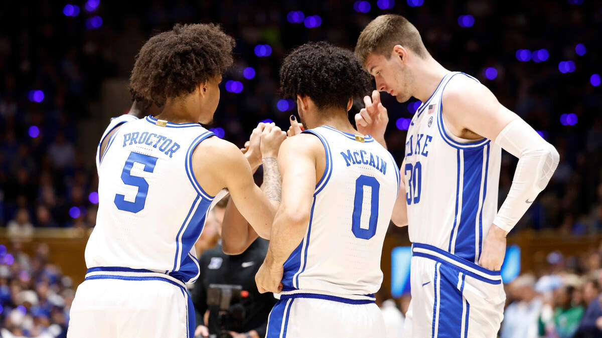 The Duke starting five, including Tyrese Proctor (5), Jared McCain (0) and Kyle Filipowski (30) huddle before Duke’s game against UNC at Cameron Indoor Stadium in Durham, N.C., Saturday, March 9, 2024.