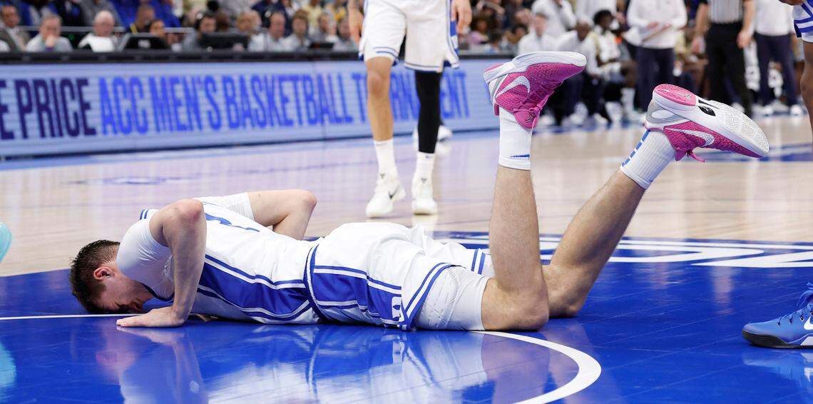 Duke’s Cooper Flagg (2) lays on the ground after being injured during the first half of Duke’s game against Georgia Tech in the quarterfinals of the 2025 ACC Men’s Basketball Tournament at the Spectrum Center in Charlotte, N.C., Thursday, March 13, 2025.