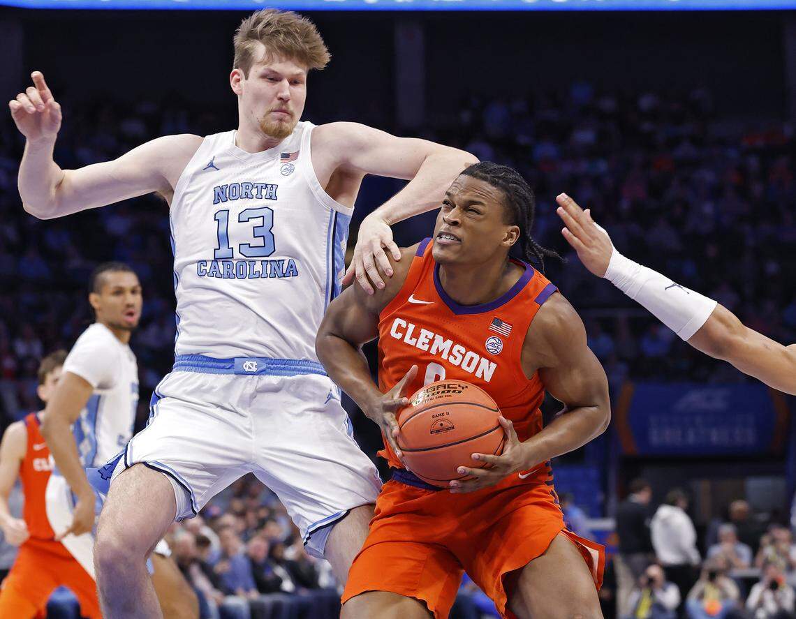 Clemson's RJ Godfrey drives past North Carolina's Henri Veesaar during the first half of the Tigers’ ACC Tournament quarterfinal game on Thursday, March 12, 2026, at the Spectrum Center in Charlotte, N.C. 