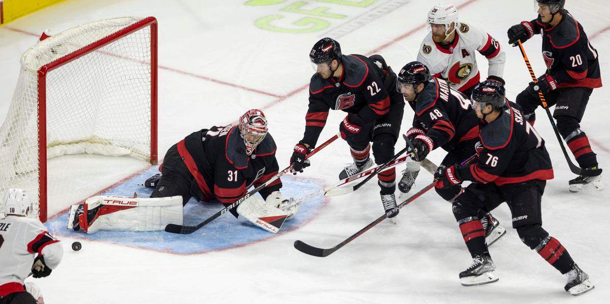 The Carolina Hurricanes goalie Frederik Anderson (31) deflects a scoring attempt by the Ottawa Senators Claude Giroux (28) in the second period on Wednesday, October 11, 2023 at PNC Arena, in Raleigh N.C.