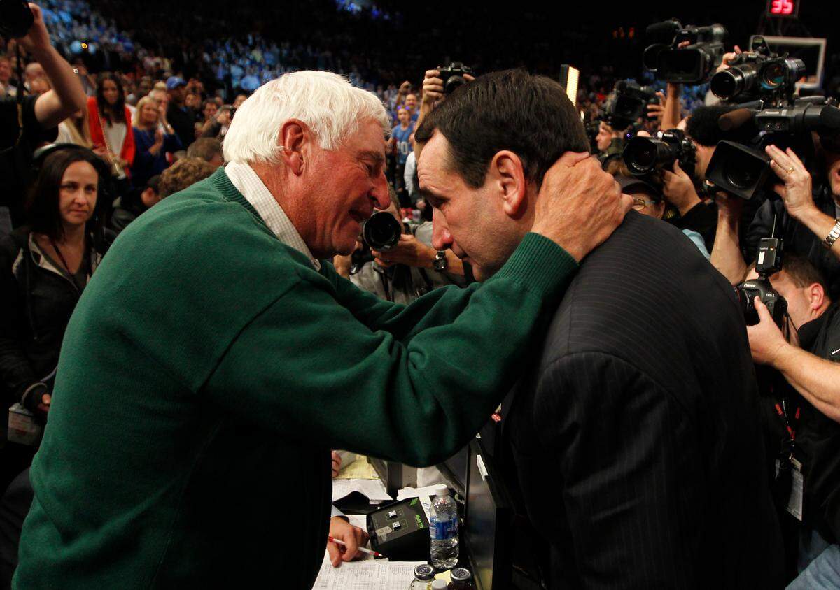 Duke head coach Mike Krzyzewski (right) speaks with mentor and former NCAA D1 record holder Bobby Knight as he wins number 903 to become the winningest coach of all time. Duke played Michigan State University at Madison Square Garden in New York City Tuesday Nov. 15, 2011.Duke played Michigan State University at Madison Square Garden in New York City Tuesday Nov. 15, 2011.