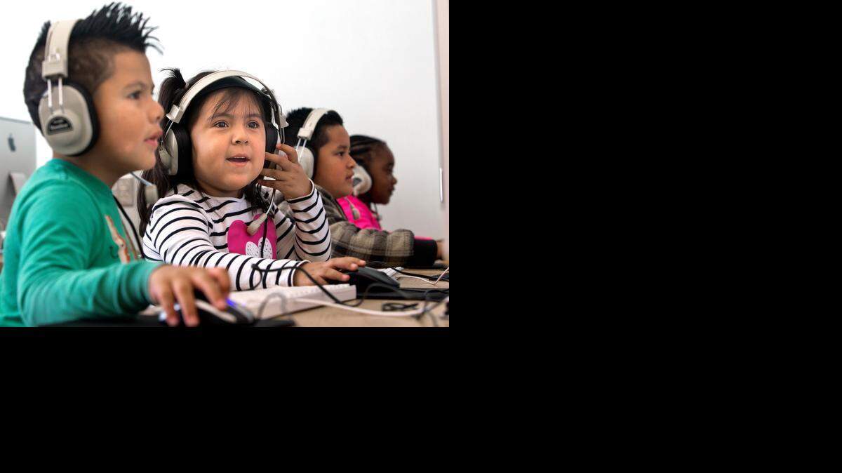 Walnut Creek Elementary School students, from left, Christian Cortez-Rivera, Bailey Valle-Quintero, Angel Sanchez-Padilla and Zaniyah Miles-Horne, work in the technology classroom in Portia Eiden’s class on Thursday.
