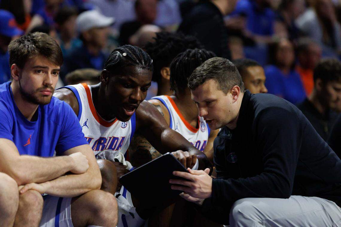 Florida Gators assistant coach John Andrzejek talks with Florida Gators center Rueben Chinyelu (9) against the Stetson Hatters during the second half at Exactech Arena at the Stephen C. O’Connell Center.